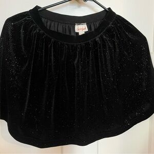 Girls  holiday, medium, black skirt with sparkle.